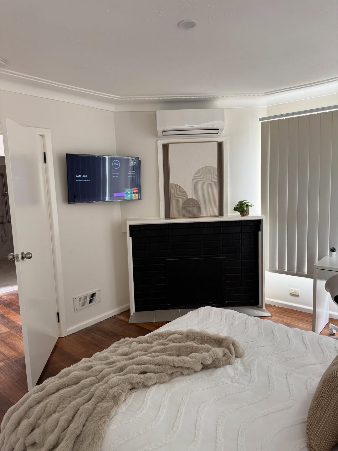 Wall-mounted TV with concealed cables and new power outlets — AmpTek Electrical