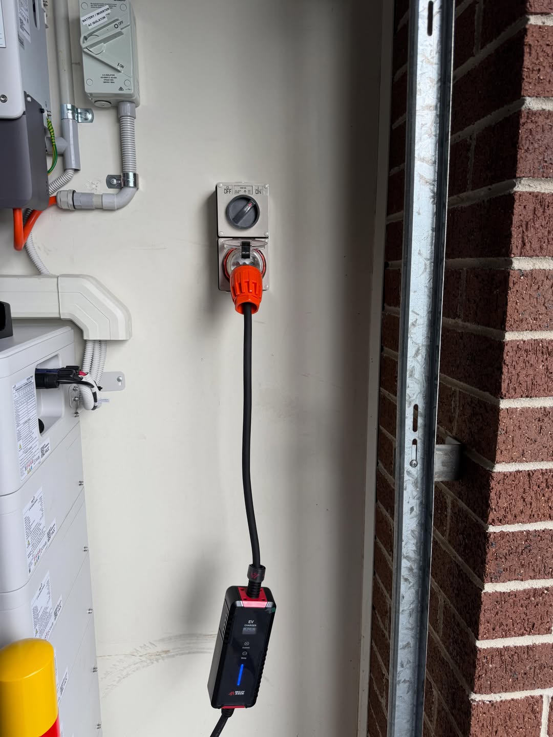 EV portable charger plugged into 3-phase socket — AmpTek Electrical